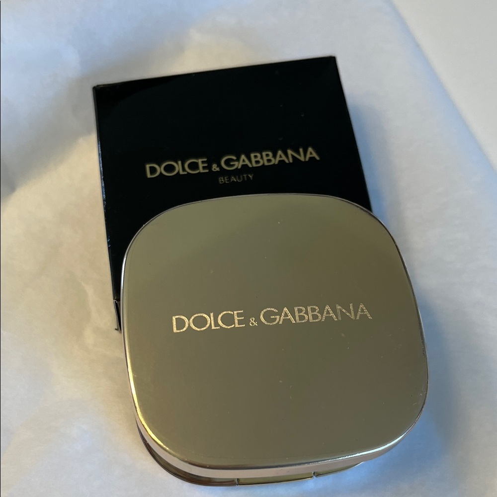 Dolce & Gabbana magnifying gold Compact mirror.. it is new with protective film